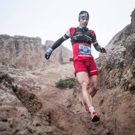 Pere Aurell on a technical downhill in red race kit