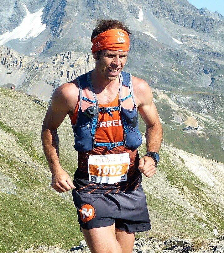Pere Aurell racing a mountain trail in Merrell kit